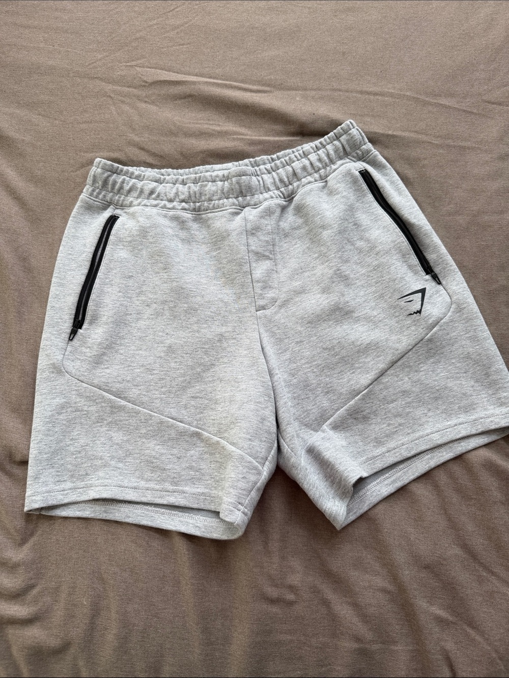 Gymshark Light Gray Athletic Men's Shorts with Black Zip Pockets